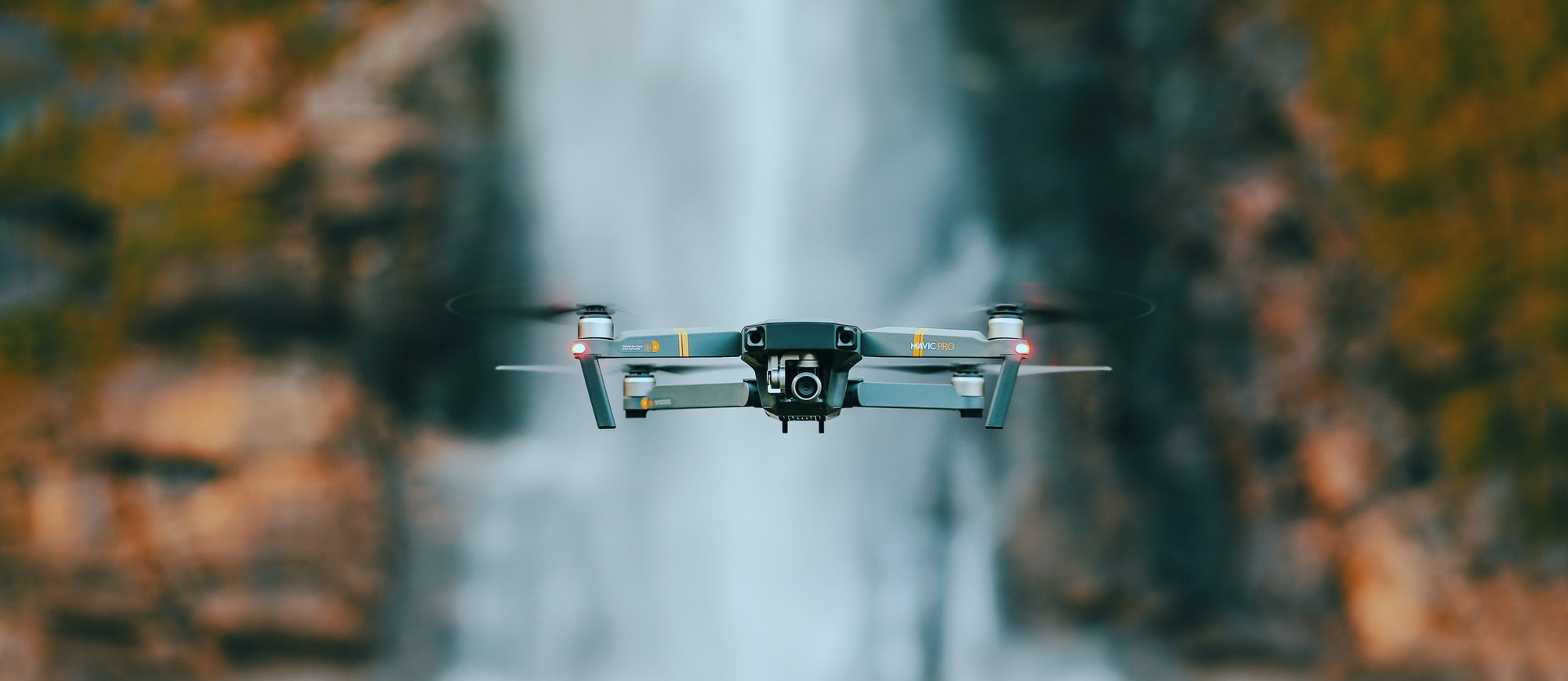 Drone in front of waterfall